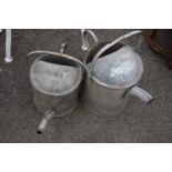 Two galvanised watering cans