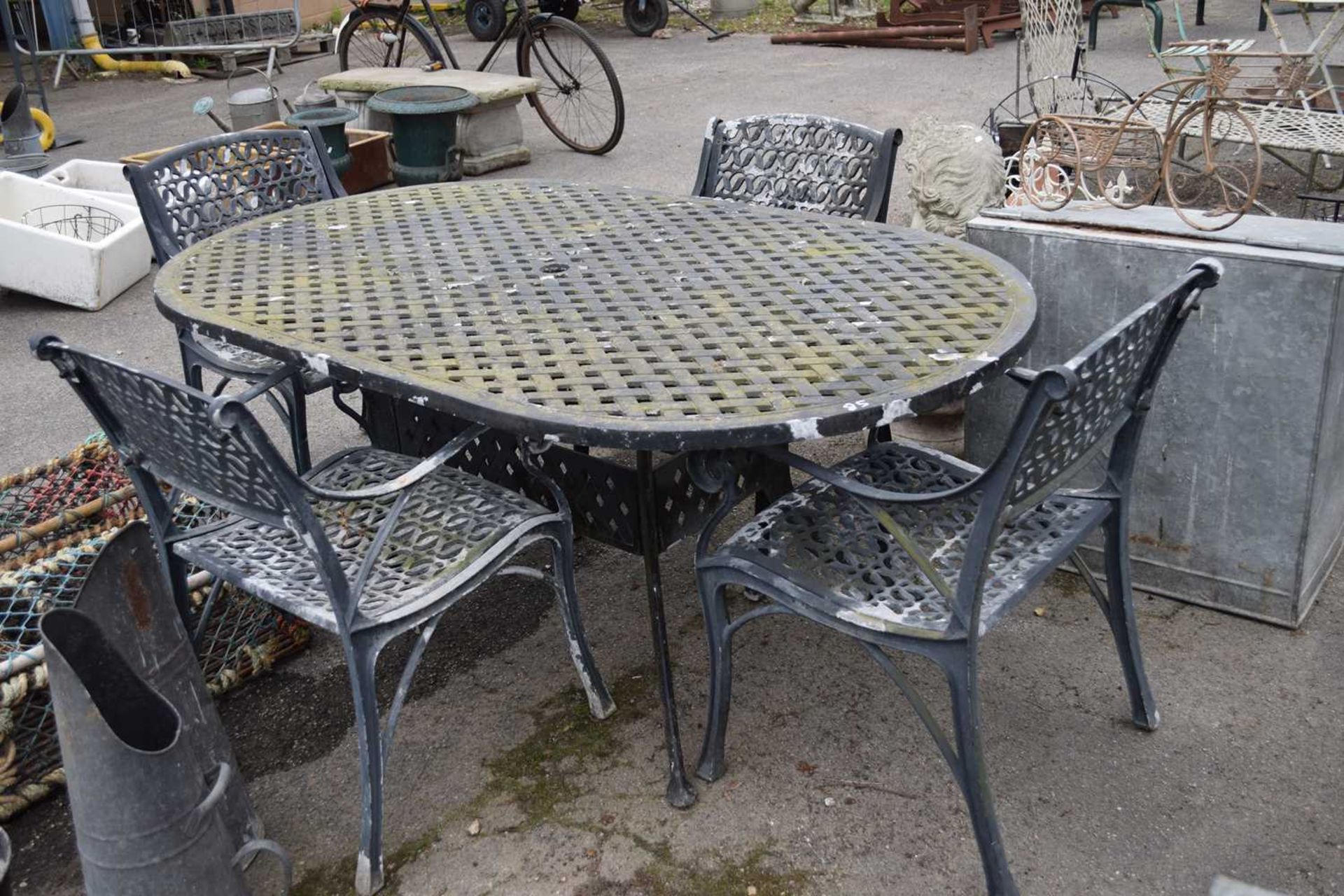 Cast garden dining set comprising table and four chairs, table width 106cm x 180cm - Image 2 of 2