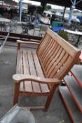 Large teak garden bench, width approx 155cm, height 110cm