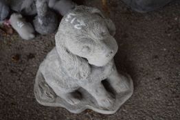 Composite garden statue formed as a dog, height approx 35cm