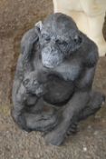Composite garden statue formed as a chimp and child, height 35cm