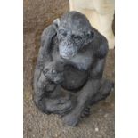 Composite garden statue formed as a chimp and child, height 35cm