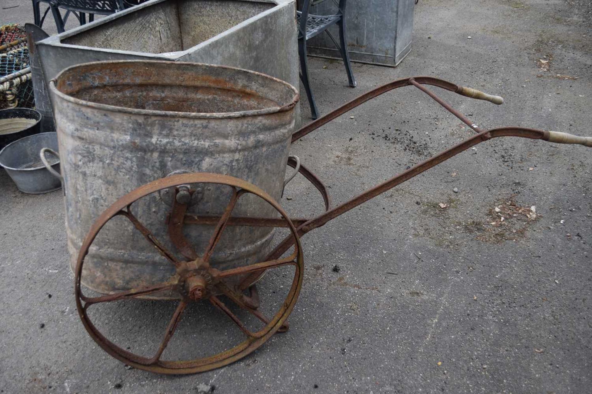 Vintage galvanised water bowser on wheels