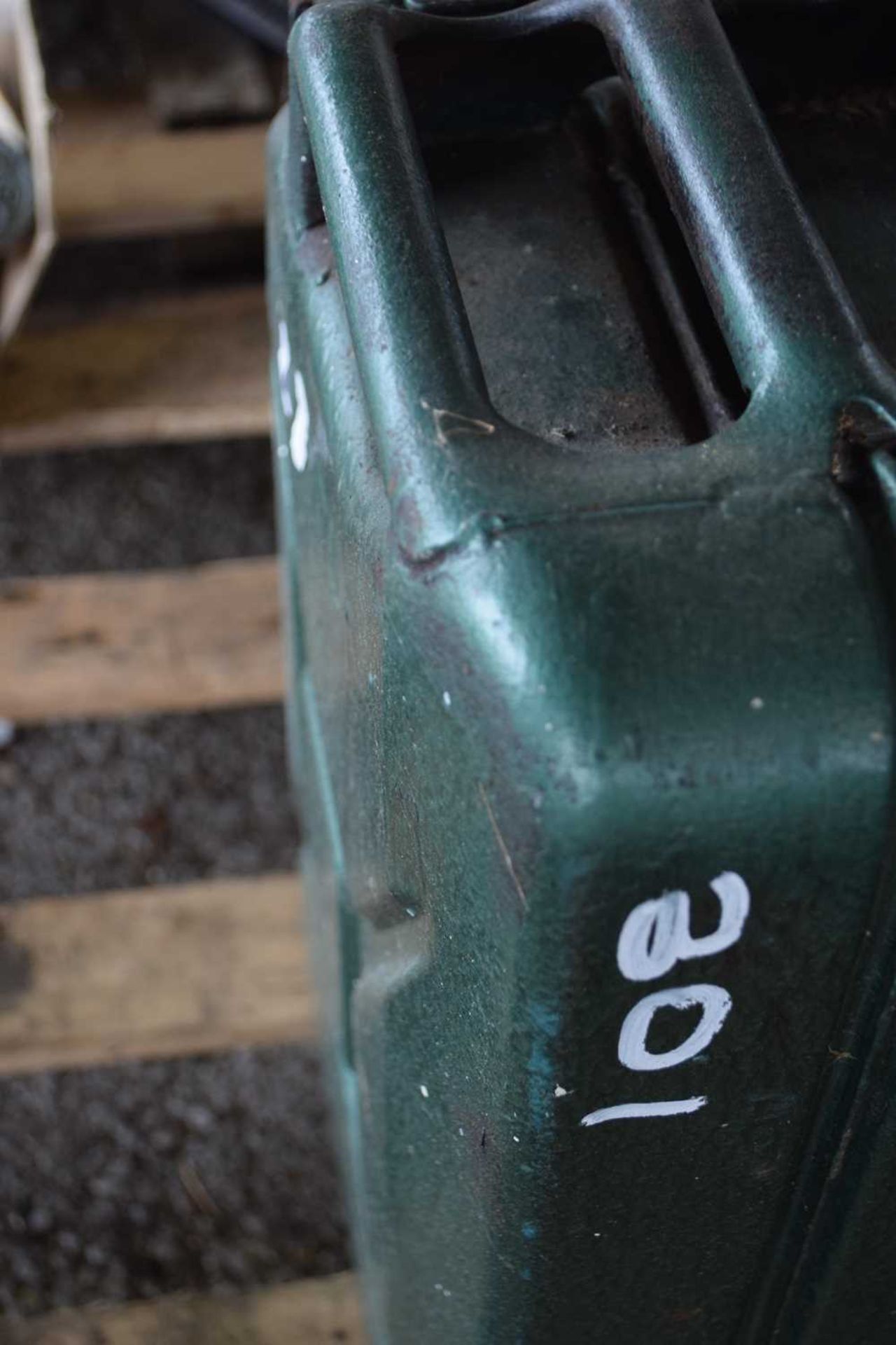 Two 10ltr jerry cans together with a metal toolbox and one further jerry can