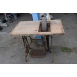 Vintage singer sewing machine attached to a grinding stone, height 76cm, width 92cm x 60cm