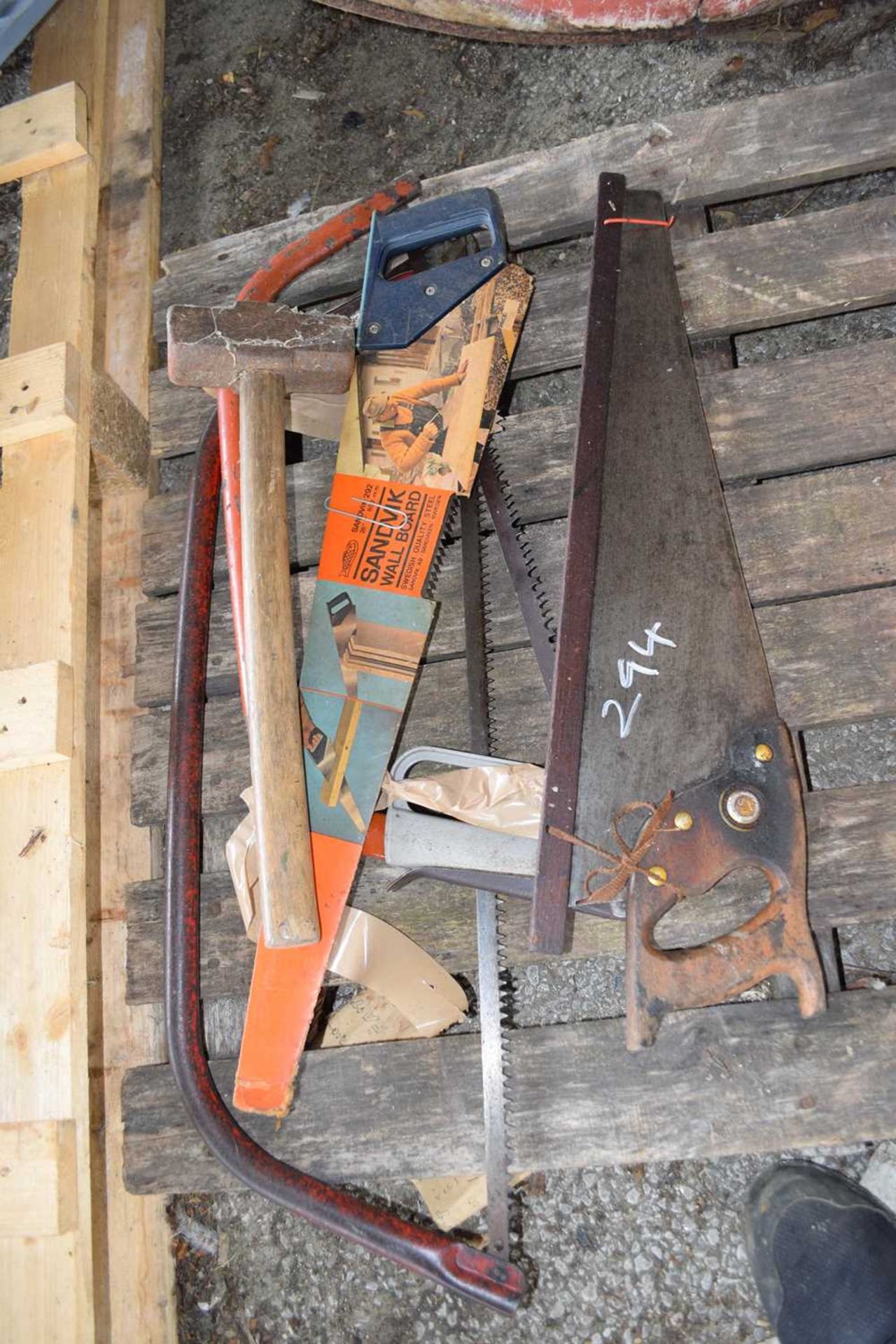 Quantity of hand saws and a sledge hammer