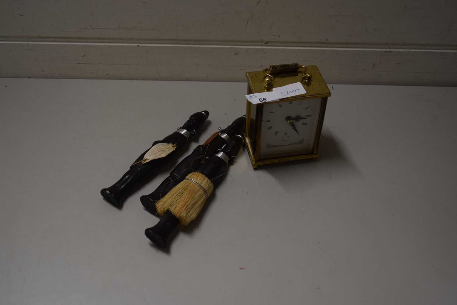 SMALL MANTEL CLOCK WITH QUARTZ MOVEMENT, TOGETHER WITH THREE ETHNIC FIGURES