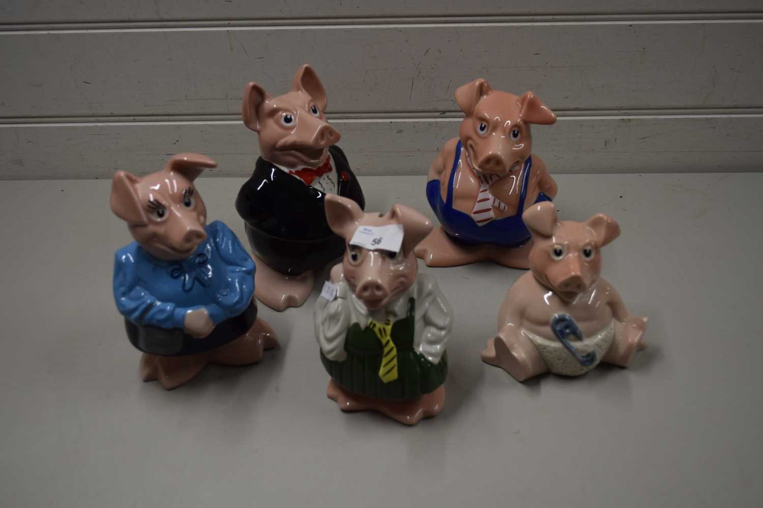 FIVE VARIOUS NAT WEST PIGGY BANKS