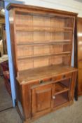 LATE 19TH CENTURY PINE DRESSER WITH SHELVED BACK AND CUPBOARD BASE FORMED AS ONE UNIT, 124CM WIDE