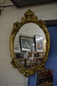 20TH CENTURY WALL MIRROR IN OVAL GILT FINISH FRAME WITH CHERUB MOUNTS