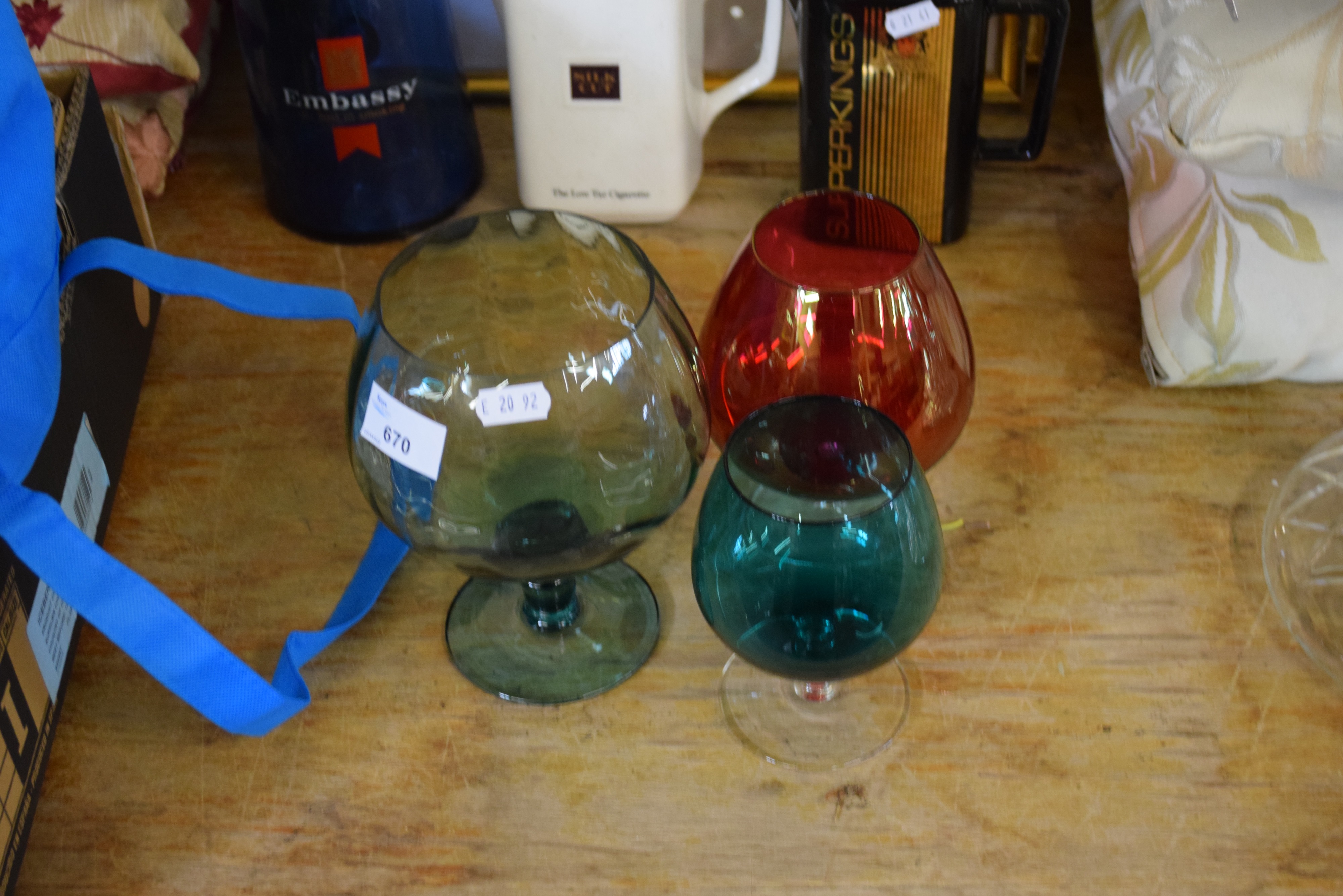 THREE COLOURED BRANDY GLASSES