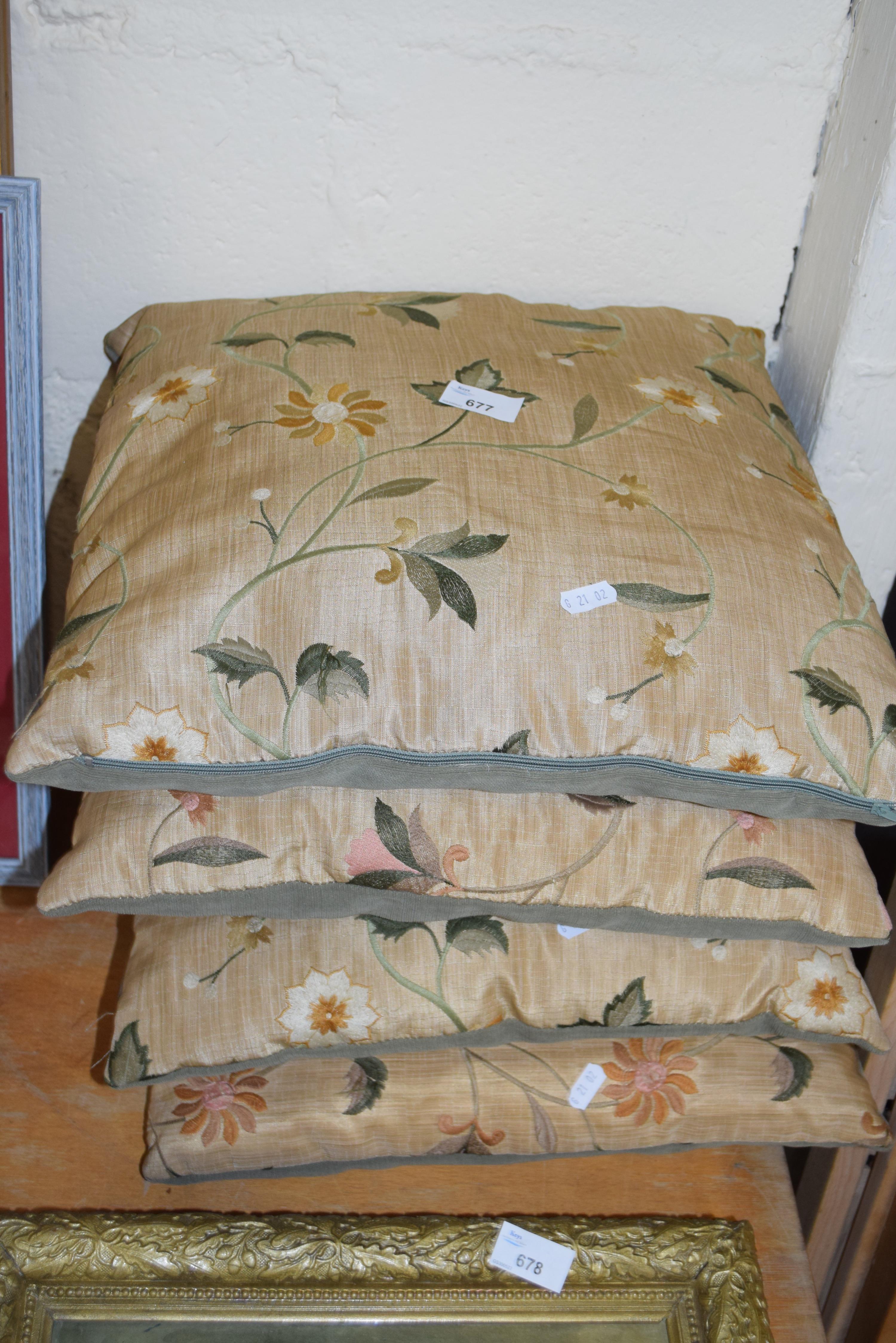 FOUR FLORAL CUSHIONS