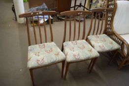 SET OF THREE RETRO TEAK DINING CHAIRS WITH BUTTERFLY UPHOLSTERED SEATS
