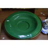 GREEN GLASS BOWL AND A FURTHER CIRCULAR BRASS TRAY