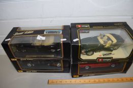 FOUR BOXED BURAGO AND MAISTO TOY CARS