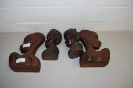 FOUR AFRICAN CARVED HARDWOOD HEADS