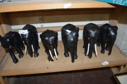 SIX EBONY ELEPHANTS