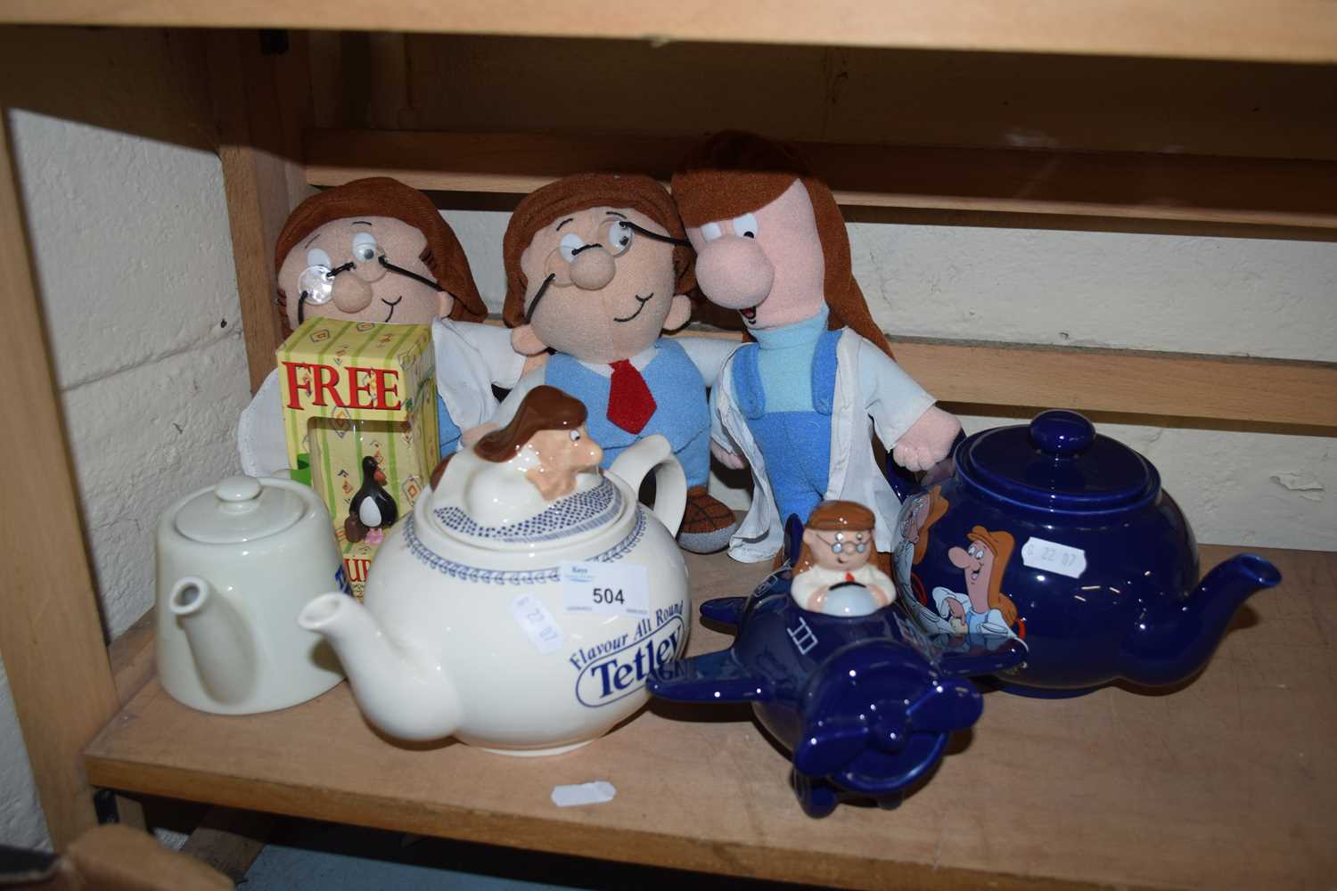 COLLECTION OF TETLEY TEA ITEMS TO INCLUDE TEA POTS, FIGURES, ETC