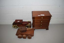 SMALL PINE FOUR DRAWER JEWELLERY CABINET TOGETHER WITH A WOODEN MODEL TANK AND A FURTHER WOODEN