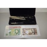 BANK OF ENGLAND TEN SHILLING NOTE AND ONE POUND NOTE, A VINTAGE AUSTRIAN BANK NOTE AND A CASE OF