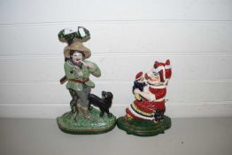 CAST IRON DOORSTOP FORMED AS MRS PUNCH TOGETHER WITH ANOTHER FORMED AS A WOODSMAN (2)