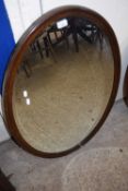 LATE 19TH/EARLY 20TH CENTURY OVAL BEVELLED WALL MIRROR IN DARK WOOD FRAME, 98CM HIGH