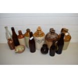 VARIOUS MIXED STONEWARE AND GLASS BOTTLES AND FLAGONS TO INCLUDE SOME LOCAL INTEREST