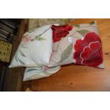 THREE FLORAL CUSHIONS