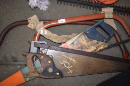 Quantity of hand saws and a sledge hammer