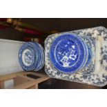 WILLOW PATTERN AND OTHER BLUE AND WHITE PLATES AND SERVING DISHES