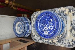 WILLOW PATTERN AND OTHER BLUE AND WHITE PLATES AND SERVING DISHES