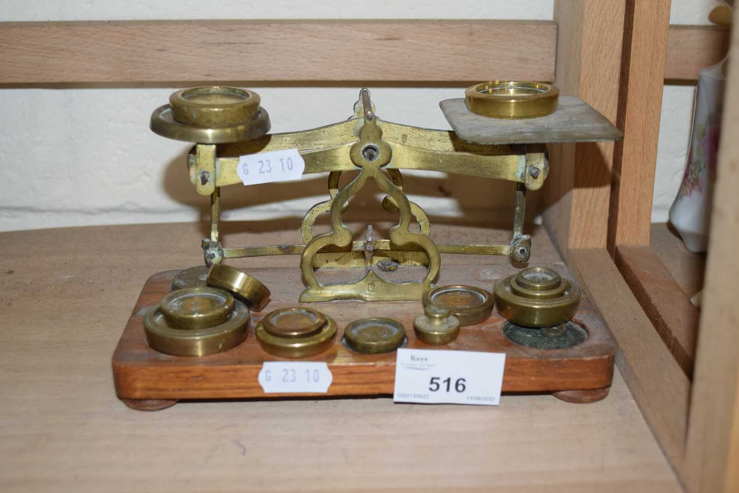 VINTAGE BRASS AND HARDWOOD MOUNTED POSTAL SCALES WITH ACCOMPANYING WEIGHTS