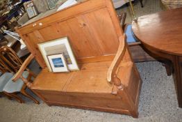 ANTIQUE PINE SETTLE WITH PANELLED BACK AND BOX BASE WITH TWO HINGED LIDS