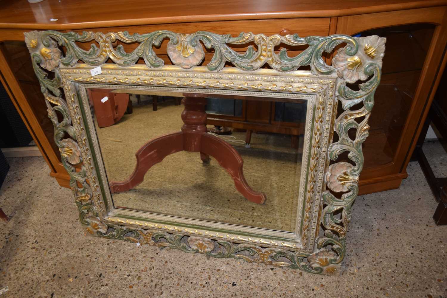 20TH CENTURY BEVELLED RECTANGULAR WALL MIRROR IN A PIERCED FLORAL CARVED FRAME