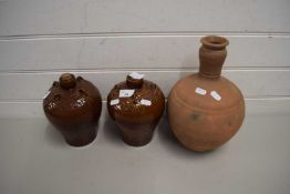 PAIR OF BROWN GLAZED POTTERY JARS AND A FURTHER TERRACOTTA VASE