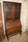 EARLY 20TH CENTURY OAK BUREAU BOOKCASE WITH LEAD GLAZED TOP SECTION