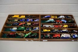 TWO WOODEN DISPLAY CASES CONTAINING A SELECTION OF VARIOUS TOY VANS, MAINLY LLEDO