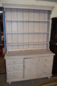 PAINTED PINE DRESSER CABINET WITH THREE SHELF BACK OVER A BASE WITH SIX DRAWERS AND ONE PANELLED