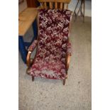 LATE 19TH CENTURY BUTTON UPHOLSTERED AND SCROLL ARMED ARMCHAIR