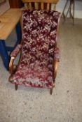 LATE 19TH CENTURY BUTTON UPHOLSTERED AND SCROLL ARMED ARMCHAIR