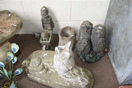 FOUR CONCRETE GARDEN ORNAMENTS - FAMILY OF OWLS, GNOME WITH WHEELBARROW, ALSATIAN AND A BOOT (4)