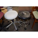 TWO REVOLVING METAL FRAMED STOOLS