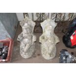 PAIR OF CONCRETE GARDEN ORNAMENTS - SEATED FIGURES