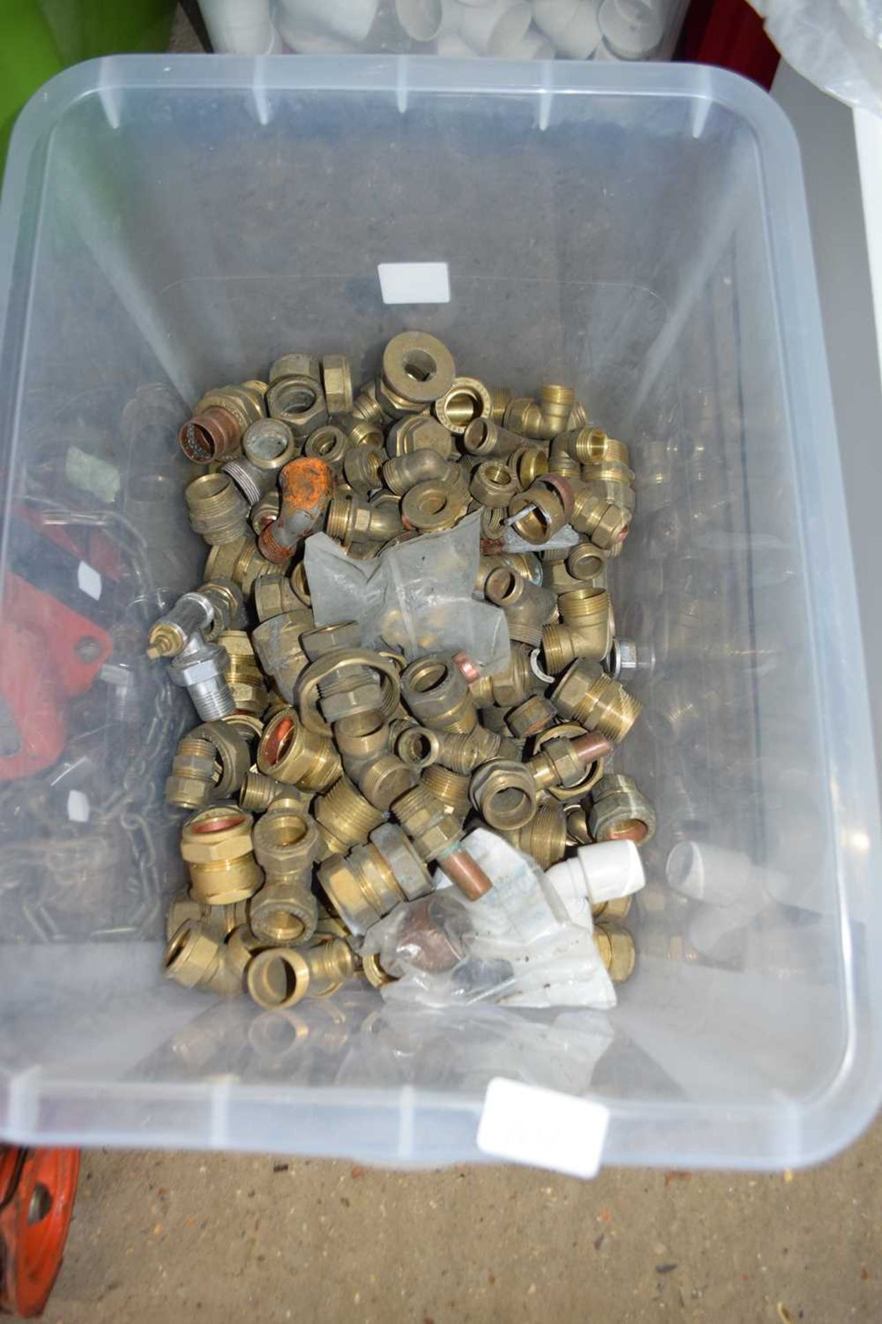 Box containing large quantity of brass connectors