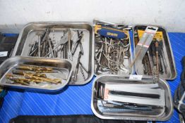 Four magnetic tins of mixed tools to include a large quantity of drill bits, SDS drill bits, Allen