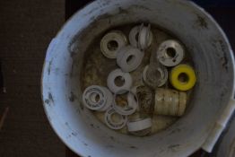 Bucket containing a quantity of PTFE thread seal tape