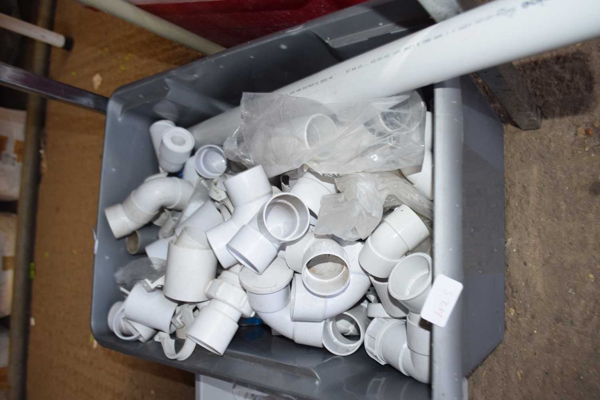 Box containing large quantity of polypipe connectors, 45 degree bends, 90 degree bends, straight