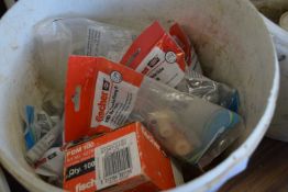 Bucket containing Fischer toilet pan and bidet side fixing set, along with others