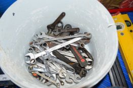 Tub containing a quantity of mixed and varying spanners, adjustable spanners etc