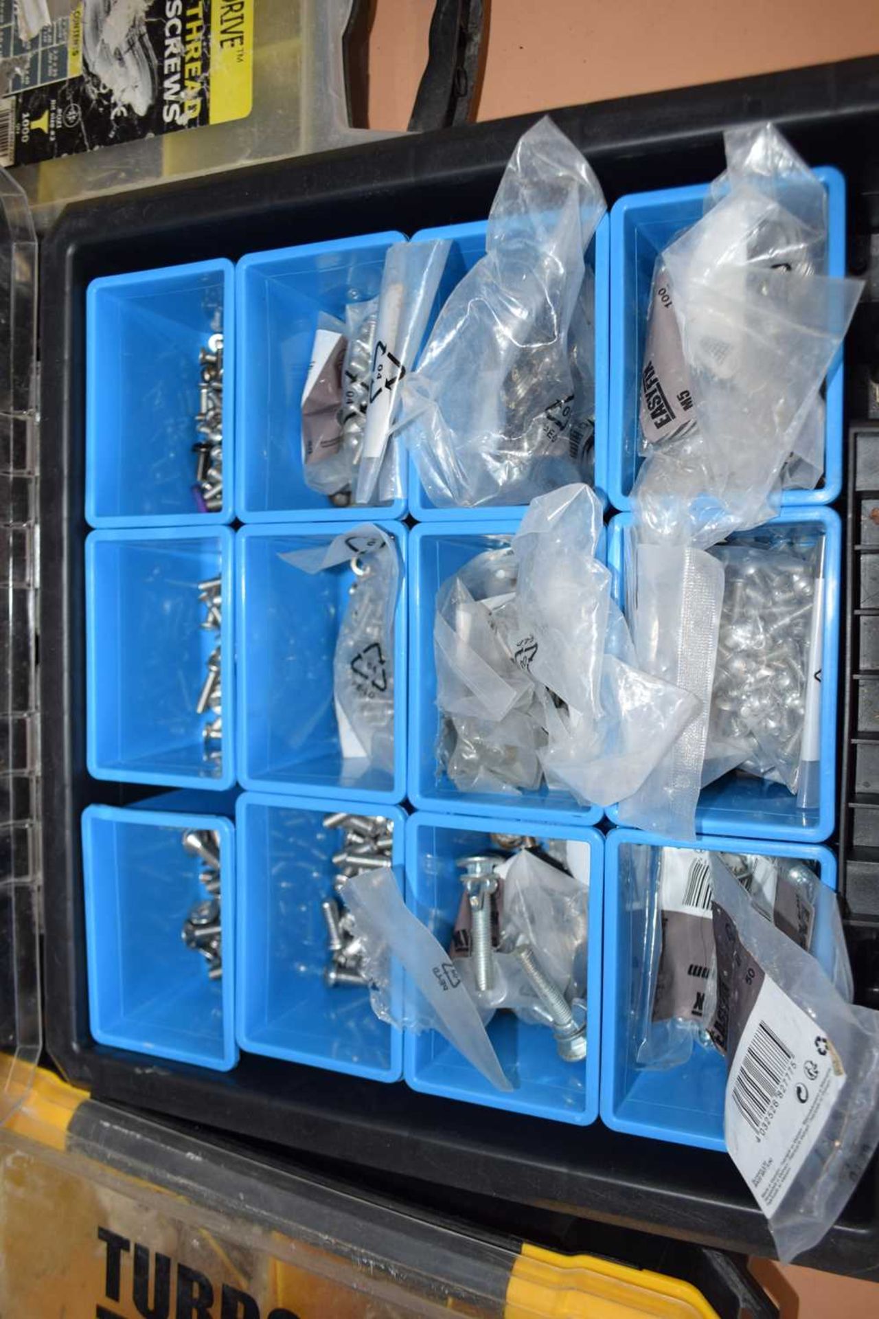Stacking storage case including nuts, bolts, etc